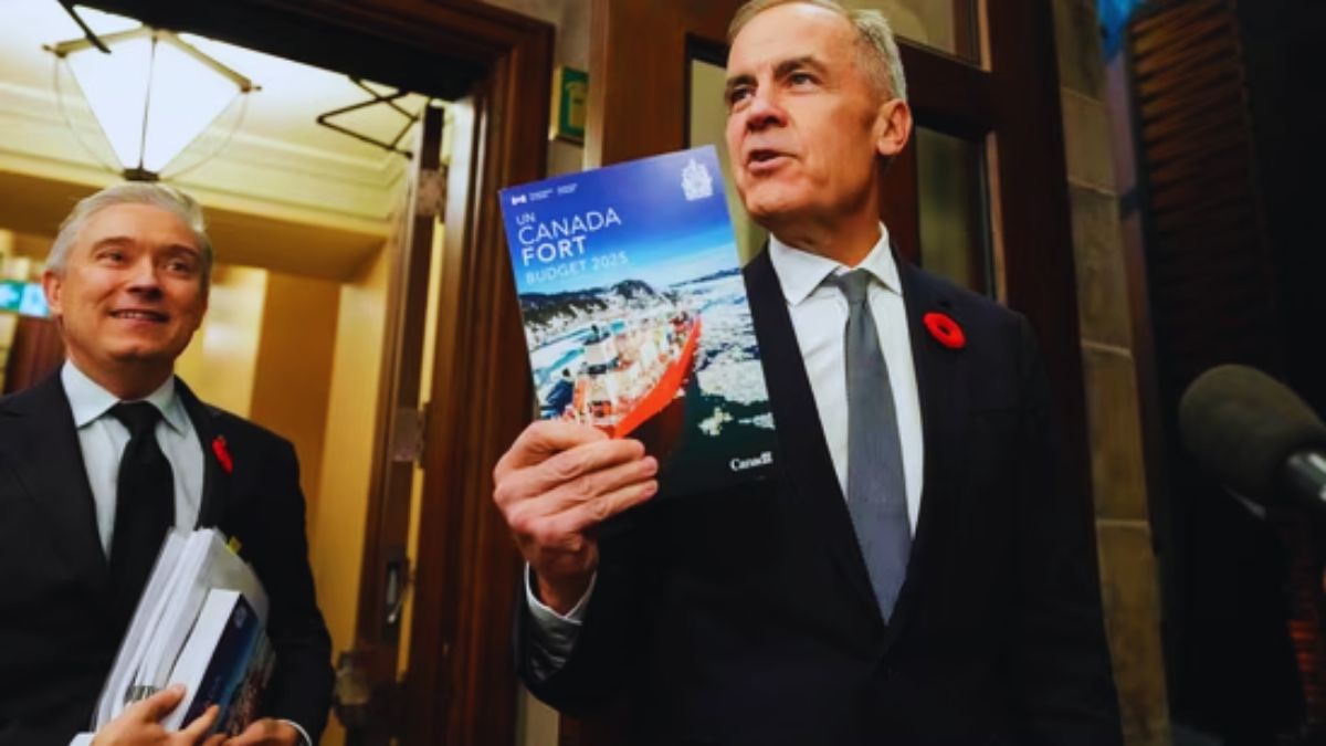 Canada H-1B visa holders, Trump $100000 H-1B fee, Mark Carney Canada immigration, Canada skilled worker program, Canada accelerated pathway H-1B, Canada research funding, Canada $1.2 billion talent plan, Canada immigration news, Canada permanent residency 2026, Canada cuts foreign student intake, Canada immigration 2025, H-1B visa Canada opportunity, Indian H-1B visa holders, Canada researcher recruitment, Canada immigration policy changes, Canada work visa 2025, Canada student visa reduction, Donald Trump H-1B visa fee, Canada vs US immigration, Canada global talent strategy, Canada innovation ecosystem, Bloomberg Canada immigration report, Canada permanent residents 2026-2028, Universities Canada immigration response, Canada economic agenda, Canada immigration system reform